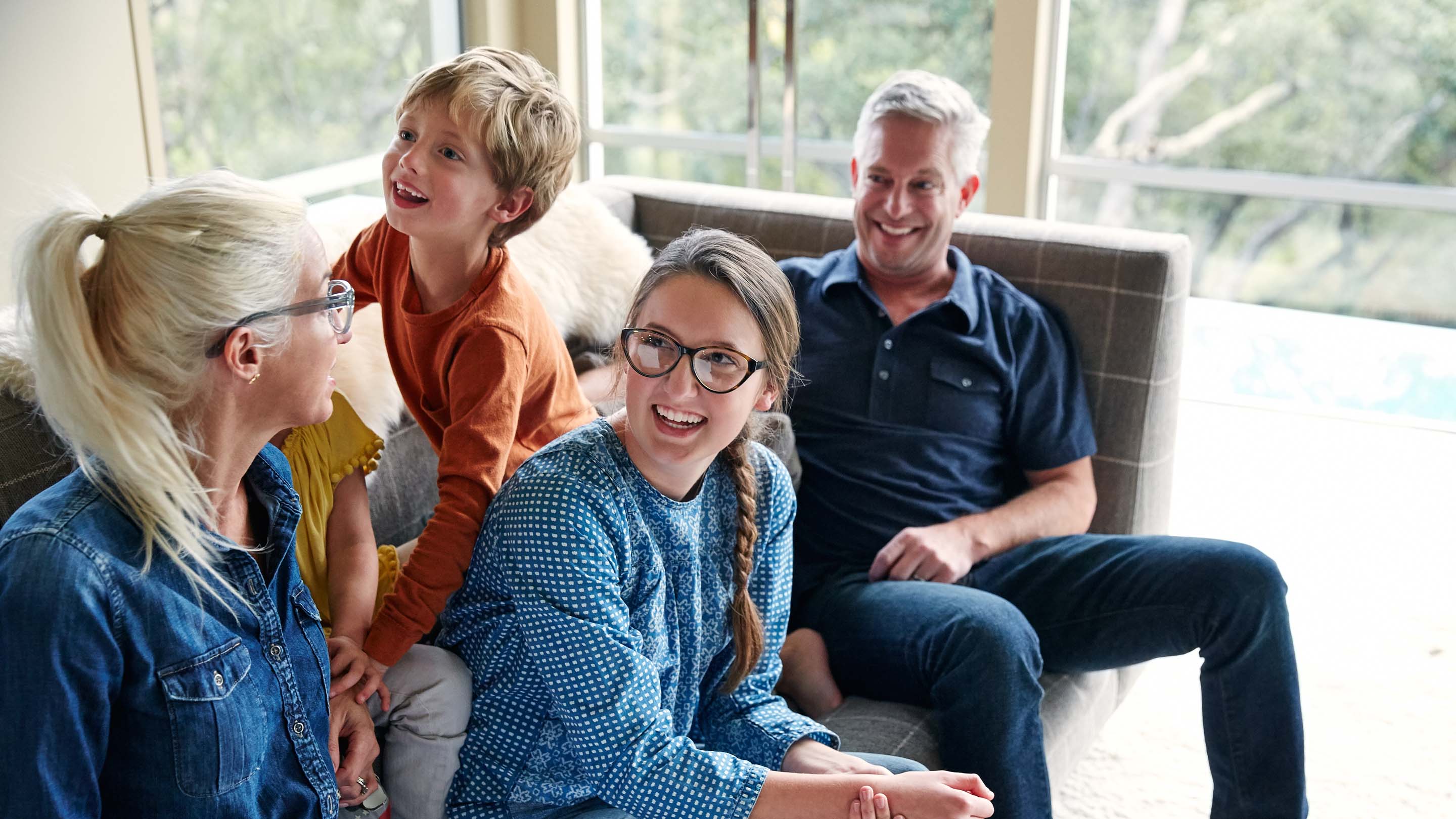 Happy family on sofa with pet